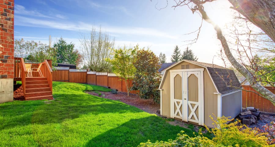 Fenced backyard with storage shed in Roanoke